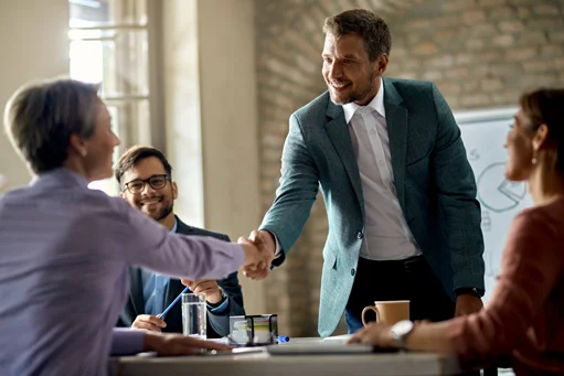 Happy customer talking with i2solvers worker